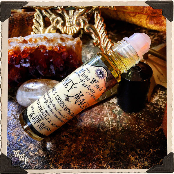 MONEY MAGICK Elixir 1/3oz. BODY OIL Rollon. Scent of Patchouli & Mint. Blessed by Citrine & Green Moss Agate Crystals.